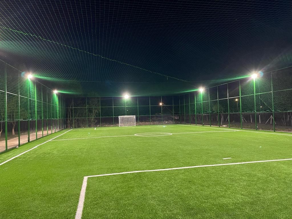 Turnkey football field execution with synthetic turf and LED floodlighting by Dromcons